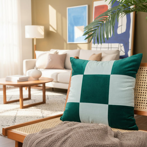 Colorful retro patchwork velvety throw pillow from The Finishing Touch Decor, featuring vibrant fabric and textured design.