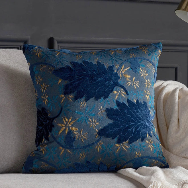 Vibrant embroidered leaf design on decorative throw pillow cover by The Finishing Touch Decor, perfect for accenting sofas and beds.