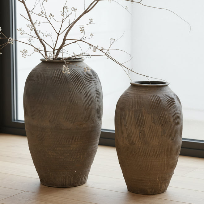Rustic Zen large terracotta floor vase from The Finishing Touch Decor, decorative vase with earthy finish and wide opening.