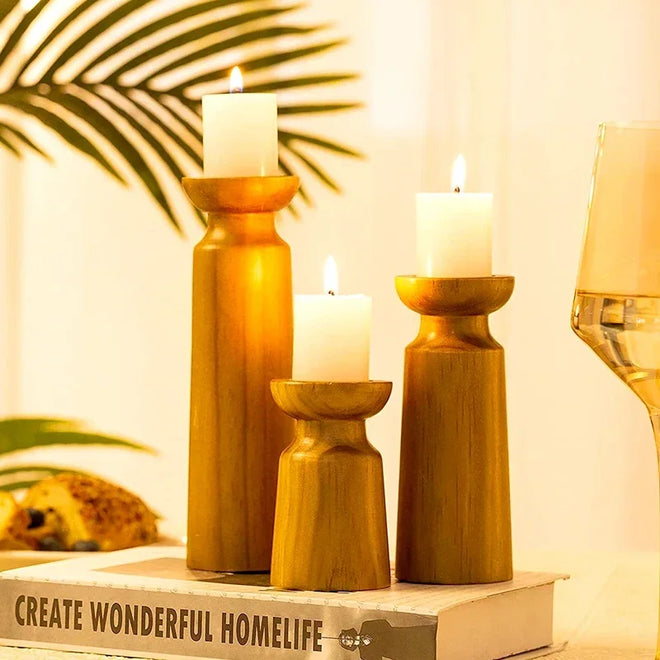 Set of three rustic natural wood candle holders, table art decor featuring handcrafted wooden accents.