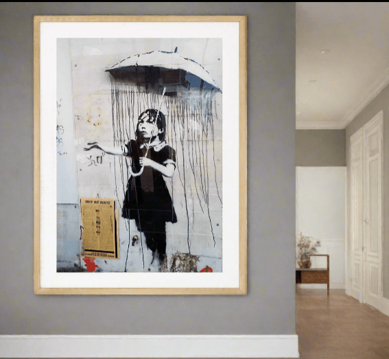 Framed Banksy "Umbrella Girl" Wall Art Print