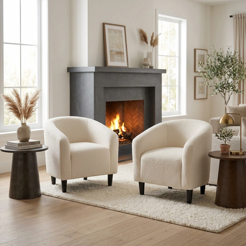 Set of 2 ecru boucle barrel accent club chairs with small, rounded design and wooden legs, perfect for stylish living spaces.
