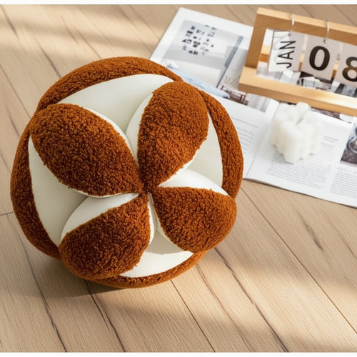Modern round geometric ball throw pillows by The Finishing Touch Decor, featuring stylish geometric patterns and plush fabric.