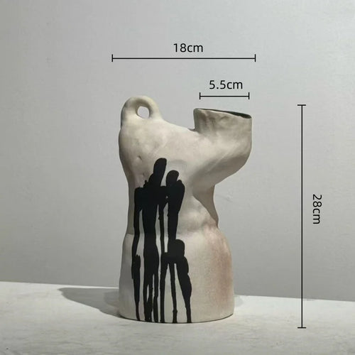 Handmade decorative vase with irregular ink drip design, showcasing unique shape and artistic craftsmanship by The Finishing Touch Decor.