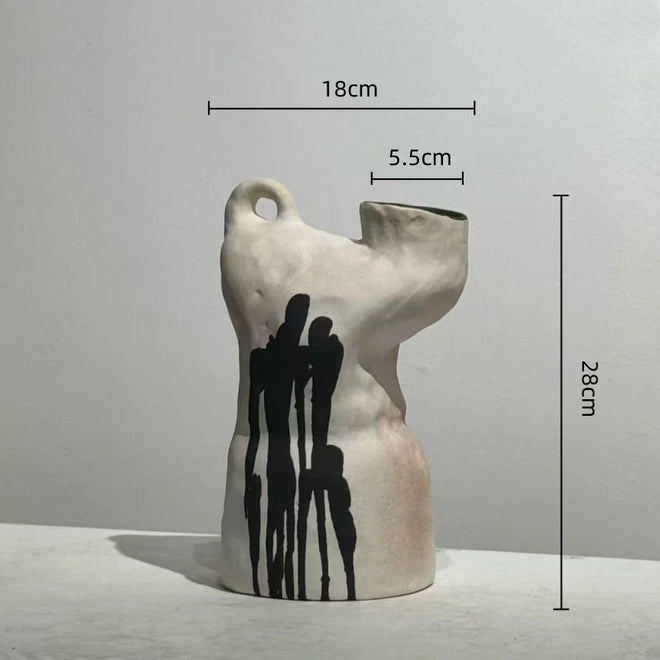 Handmade decorative vase with irregular ink drip design, showcasing unique shape and artistic craftsmanship by The Finishing Touch Decor.