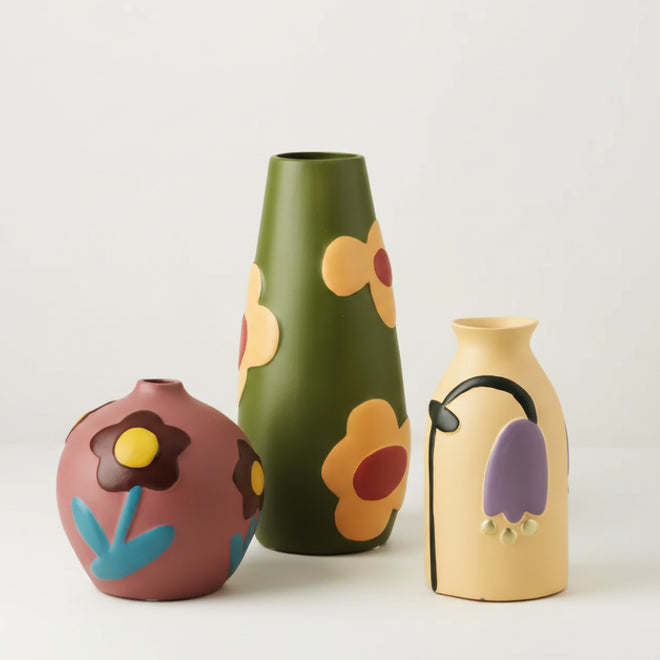 Colorful retro flower hand-painted bud vase from The Finishing Touch Decor, featuring vibrant floral designs and decorative ceramic style.