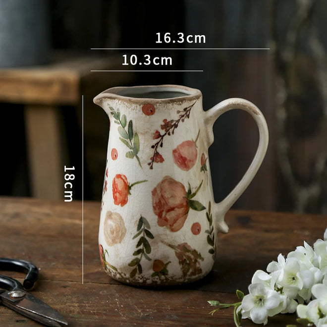 Decorative farmhouse-style pitcher vase by The Finishing Touch Decor, featuring a retro cottage design and rustic finish.