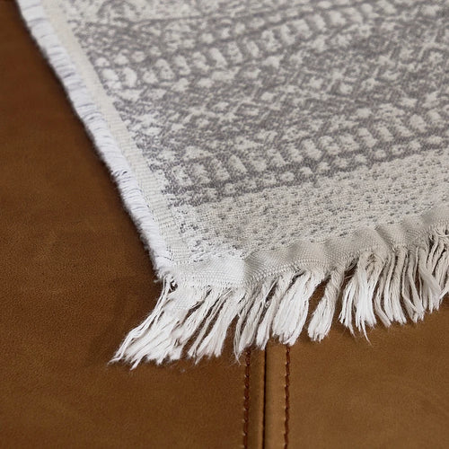 Light pure cotton grey gauze blanket from The Finishing Touch Decor, soft and breathable with a textured fabric surface.