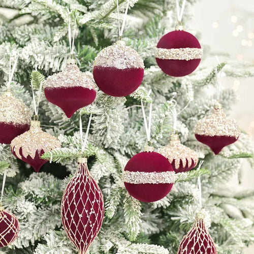 Set of 10 velvet holiday ornaments in red, green, and blue with sparkly accents for festive home decorating.