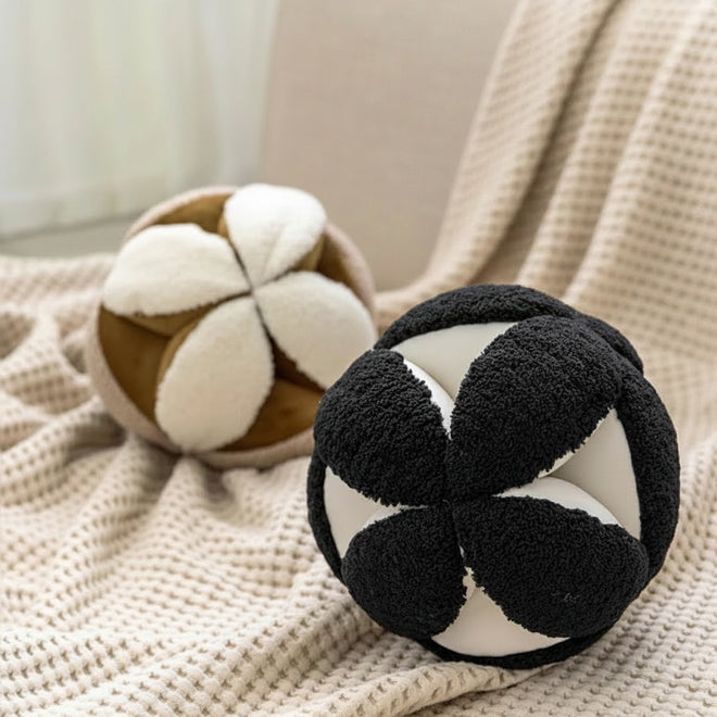 Modern round geometric throw pillow by The Finishing Touch Decor featuring a stylish spherical design with bold patterns.