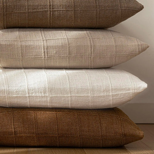Textured neutral linen cotton throw pillow cover from The Finishing Touch Decor, featuring a soft, woven fabric in a versatile shade.