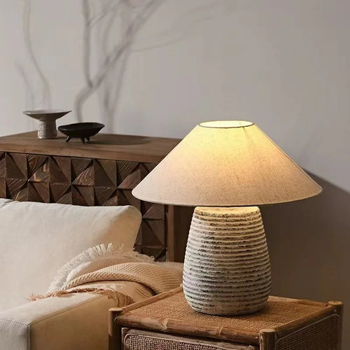 Rustic metal ceramic pottery table lamp with fabric shade and remote control dimming, by The Finishing Touch Decor.
