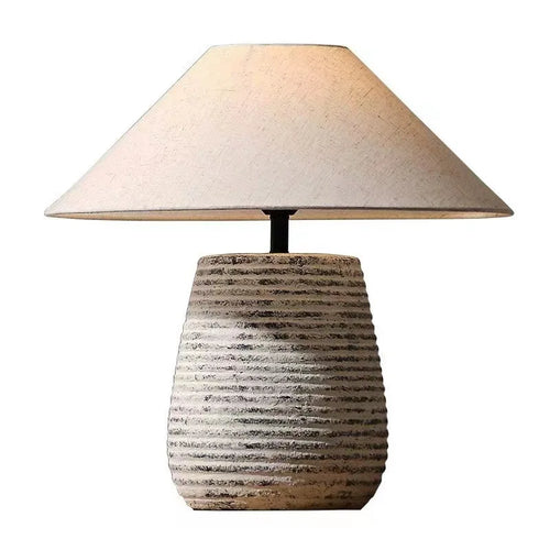 Rustic metal ceramic pottery fabric shade table lamp with remote control from The Finishing Touch Decor, ideal for cozy lighting.