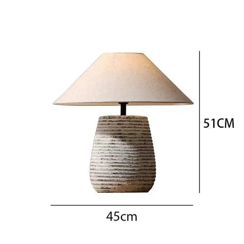 Rustic metal ceramic pottery table lamp with fabric shade and remote control dimming, by The Finishing Touch Decor.