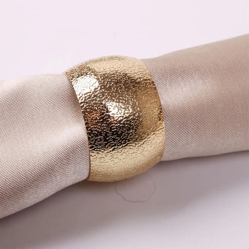 Set of four gold or silver metal dinner napkin rings for holiday decor, elegant table accents by The Finishing Touch Decor LLC.