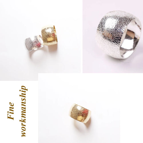 Set of four gold or silver metal dinner napkin rings, ideal for holiday decor, by The Finishing Touch Decor, LLC.