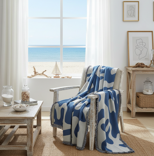 Blue and white coral pattern coastal throw blanket with fringed edges from The Finishing Touch Decor, LLC.