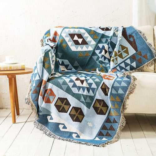 Large colorful boho ethnic throw blanket by The Finishing Touch Decor, LLC, featuring vibrant, bold bohemian patterns and soft fabric.