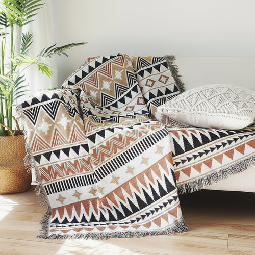 Large colorful boho ethnic throw blanket by The Finishing Touch Decor, LLC, featuring vibrant, bold patterns on soft fabric.