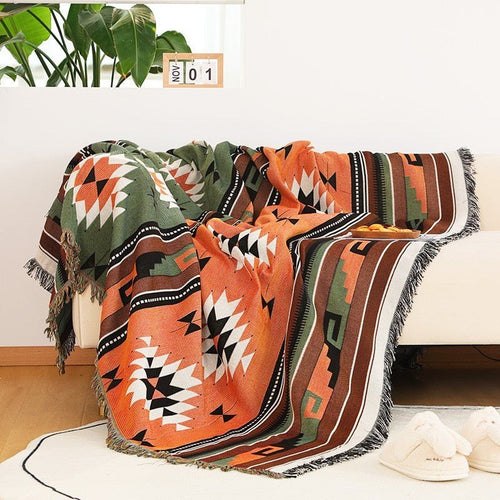 Large colorful boho ethnic throw blanket by The Finishing Touch Decor with vibrant patterns and bold design, perfect for cozy decor.