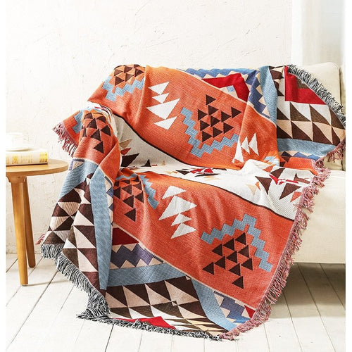 Large colorful boho ethnic throw blanket from The Finishing Touch Decor, LLC, featuring vibrant patterns and bold bohemian design.