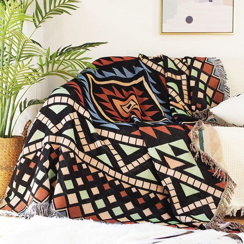 Large colorful boho ethnic throw blanket from The Finishing Touch Decor, LLC, featuring vibrant, bold patterns on soft fabric.