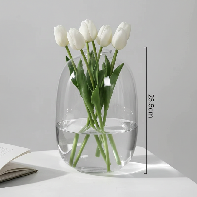 Minimalist transparent glass rounded bulb vase with smoky brown tint, decorative design by The Finishing Touch Decor, LLC.