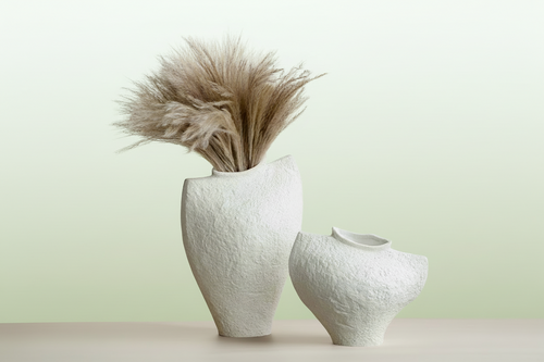 Irregular white ceramic minimalist textured decorative vase by The Finishing Touch Decor, LLC, with a modern, uneven surface design.