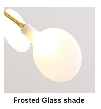 Golden Branch Glass Lollipop Chandelier Lighting with frosted glass shades and warm white bulbs, elegant decor from The Finishing Touch Decor.
