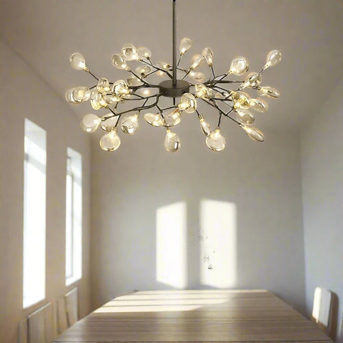 Golden branch glass lollipop chandelier lighting with frosted glass shades and 45 warm white bulbs, by The Finishing Touch Decor.