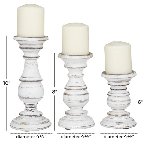 Set of three white vintage finish wood candle holders, decorative table art with distressed style from The Finishing Touch Decor, LLC.