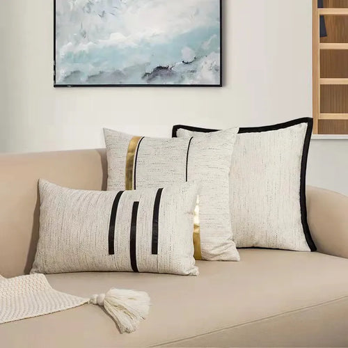 Ivory, black, and gold striped throw pillow covers by The Finishing Touch Decor, LLC, featuring modern jacquard design.