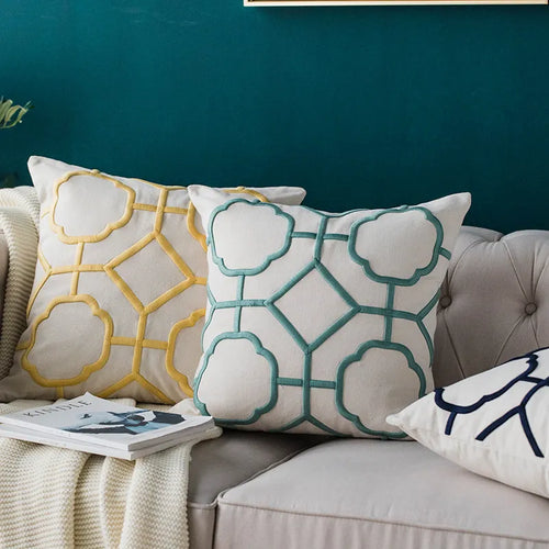 Embroidered linen throw pillow covers with a quatrefoil pattern from The Finishing Touch Decor, LLC, for stylish home decor accents.