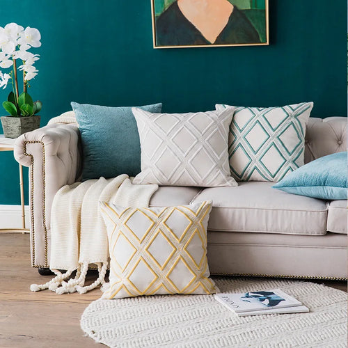 Embroidered linen throw pillow covers with a quatrefoil pattern from The Finishing Touch Decor, LLC, featuring elegant decorative accents.