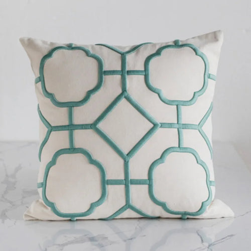 Embroidered linen throw pillow covers with a quatrefoil pattern from The Finishing Touch Decor, LLC, showcasing elegant textured accents.